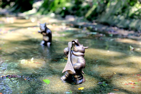 Brad Oldham bronze hippo guitar rocking sculpture